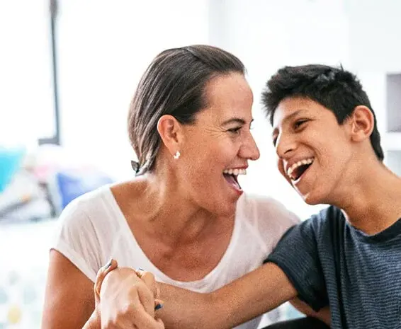 Both caregiver and loved one looking happy because the caregiver found ways of coping with caregiving and preventing caregiver burnout.